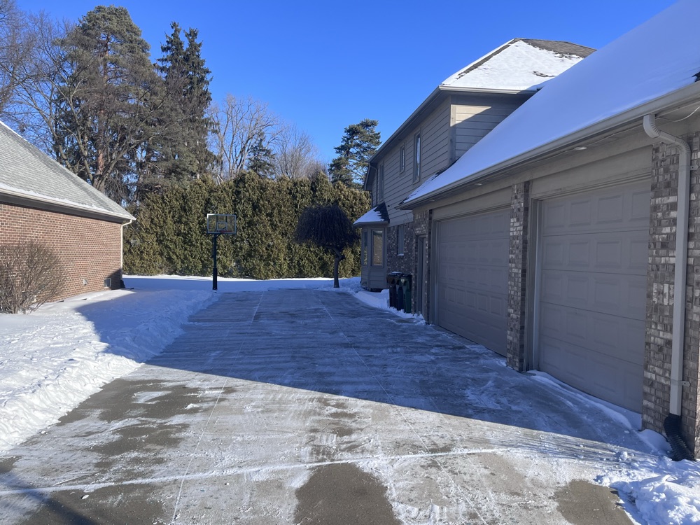 A cleared driveway representing full-season snow removal coverage